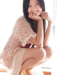 Mayumi Yamanaka smiles while undressing with erotic moves