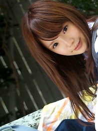 Manami Sato in short uniform skirt spends time in the park